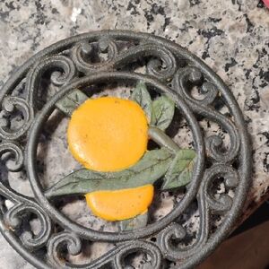 Decorative Cast Iron Trivet with Orange Accents